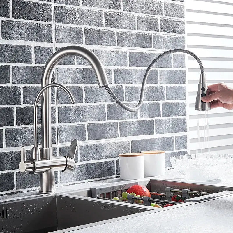 Modern brushed stainless steel arched water filter faucet with flexible pull-out spray head and dual handles for kitchen use