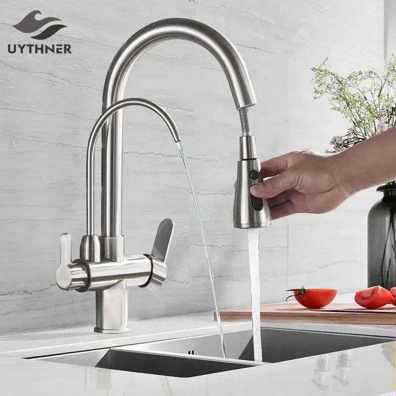 Stainless steel arched water filter faucet with a sleek pull down spray head for kitchen use