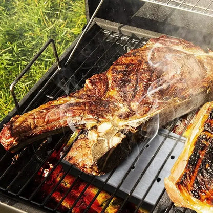 Stainless steel bbq smoker box with wood chips infuser enhances grilled t-bone steak with rich charred flavor