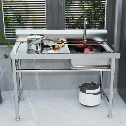 Stainless steel commercial kitchen sink with single basin, left platform, high backsplash, and integrated faucet