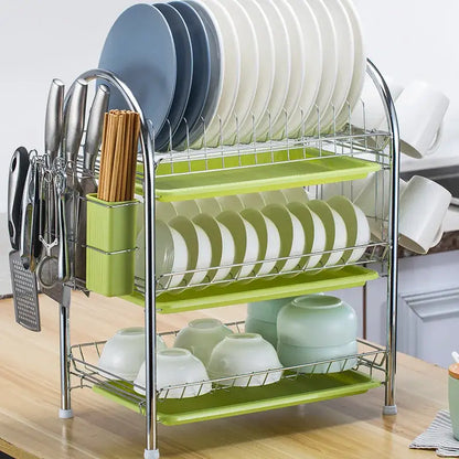 Three-tiered stainless steel and lime green plastic kitchen drying rack with integrated knife holder and dish organizer shelf