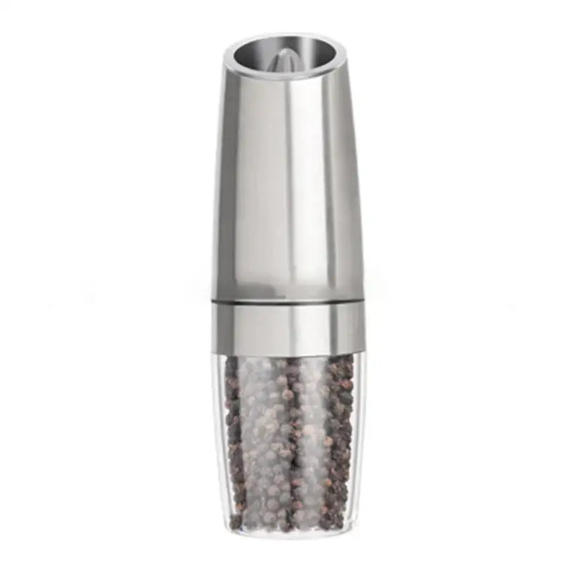 Stainless steel electric pepper grinder with clear base filled with black and white peppercorns kitchen accessory