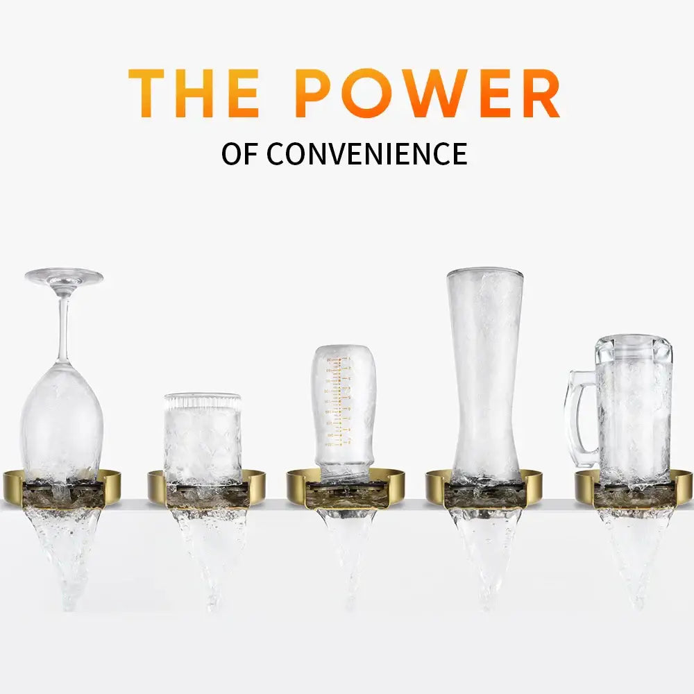 Five clear glass vessels on a gold stainless steel glass rinser with black spiderweb drain for automatic cup washing