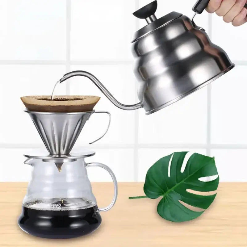 Shiny stainless steel pour-over coffee dripper with ridged conical shape on glass carafe for decorbites gooseneck coffee kettle use