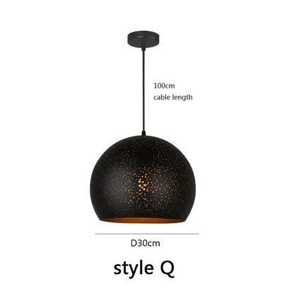 Black spherical pendant light with speckled texture and gold interior by decorbites black nordic for dining room decor