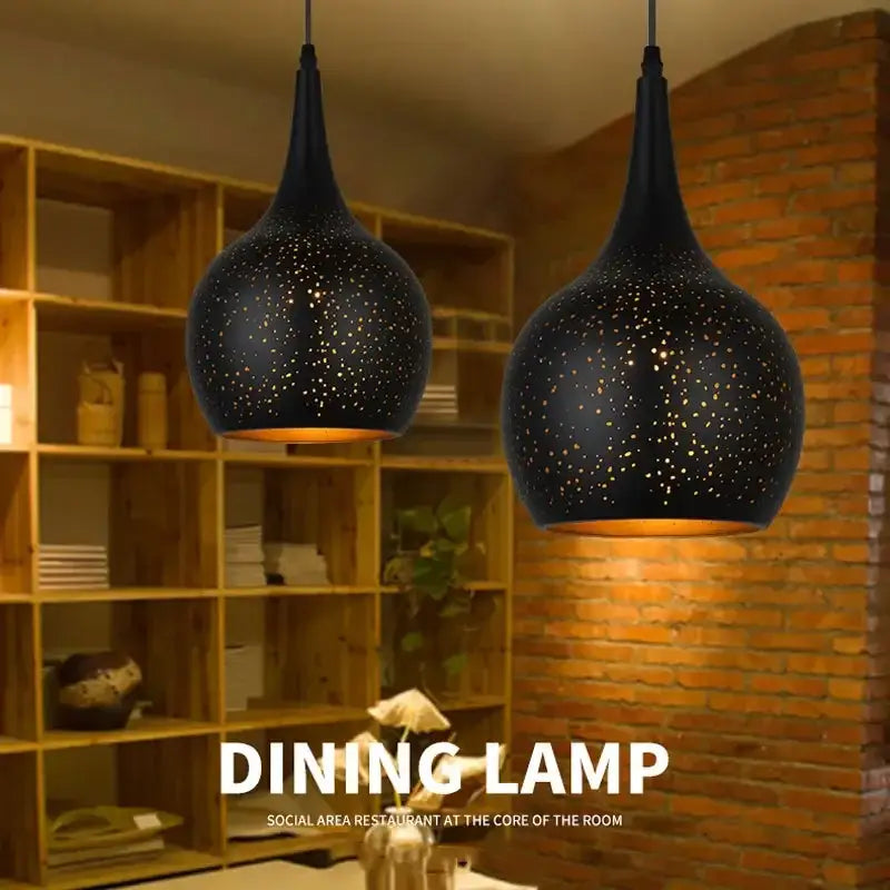 Black nordic pendant light with starry speckled design and warm amber lighting by decorbites black for dining room decor