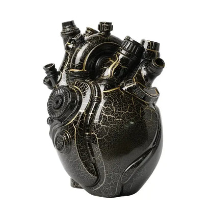 A glossy black steampunk heart cardiac vase with gold crackle detailing and mechanical components for decorbites heart decor