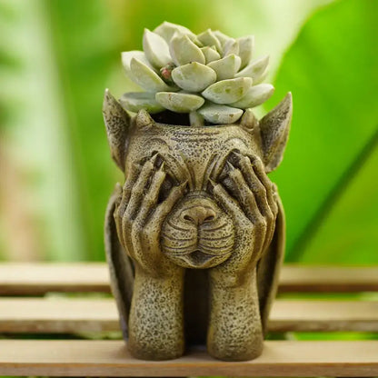 Textured greenish-gray stone gargoyle resin vase sculpture holding a pale green succulent for garden decorbites decor