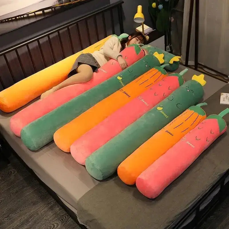 A vibrant orange pink and green decorbites cylindrical soft pregnancy sleep body pillow with embroidered face features