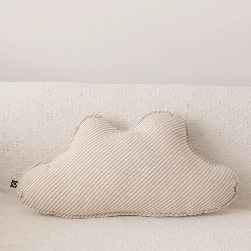 A soft cream-colored decorbites cloud star pillow with striped corduroy and stitched edges for kids bedroom decor