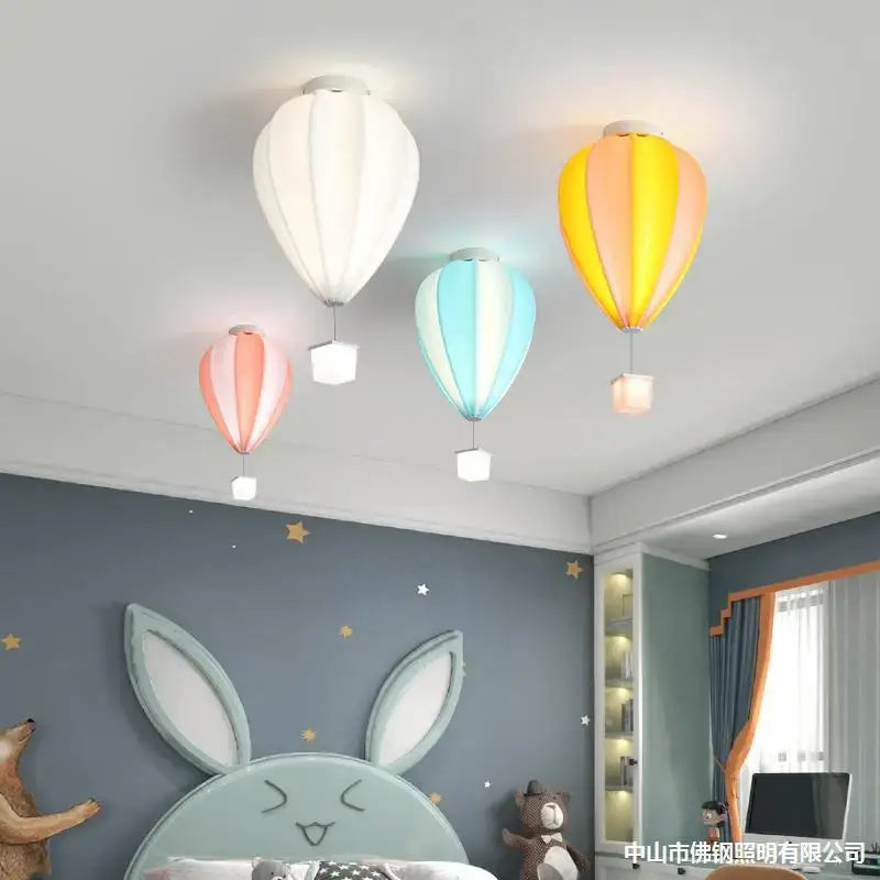 Striped fabric hot air balloon lamp in white, yellow-orange, and blue-pink by decorbites hot air for kids bedroom ceiling decor