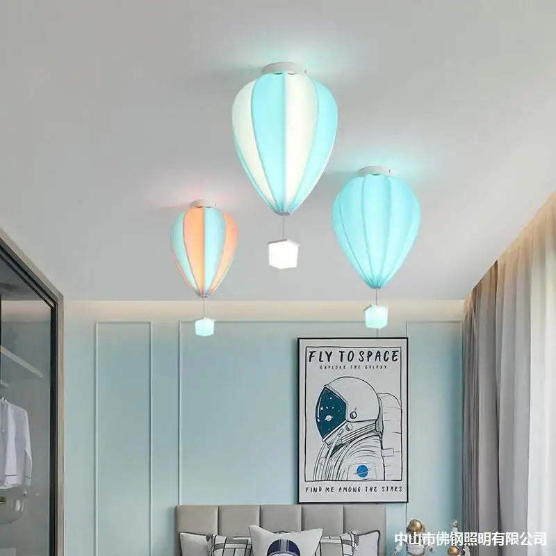 Three pastel striped fabric hot air balloon lamps with soft glowing bases for kids bedroom decorbites hot air balloon lamp