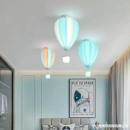 Three pastel striped fabric hot air balloon lamps with soft glowing bases for kids bedroom decorbites hot air balloon lamp
