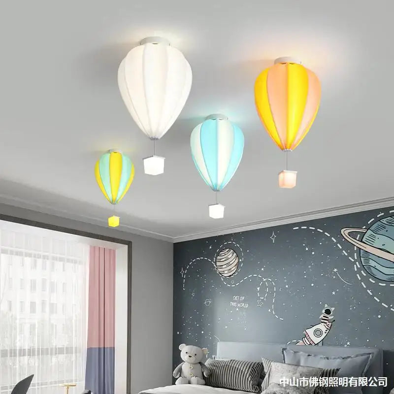 Three colorful decorbites hot air balloon fabric lamps in white yellow-orange and blue-green for kids bedroom ceiling light