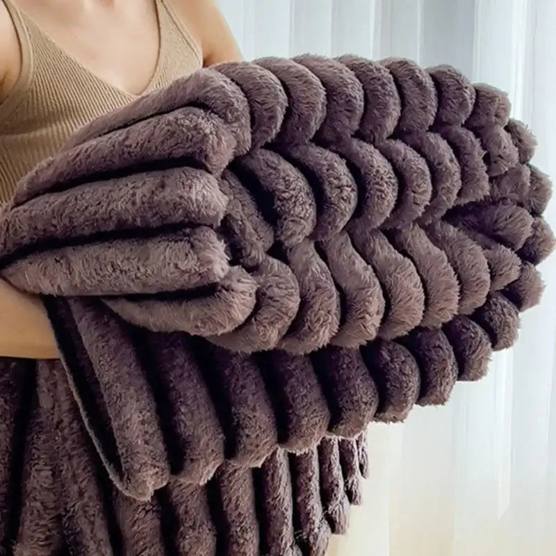A plush chunky knit striped gray and black faux rabbit plush blanket with a soft textured surface for bedroom decorbites dark faux