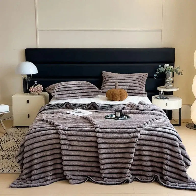 Plush gray ribbed throw blanket with soft textured surface and subtle sheen in decorbites dark faux rabbit plush design