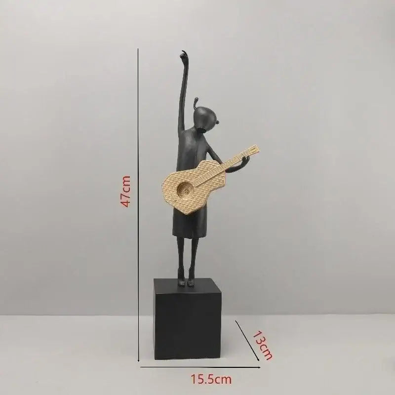 Stylized black and gold guitarist resin figure holding woven wicker guitar on black base for living room decorbites decor