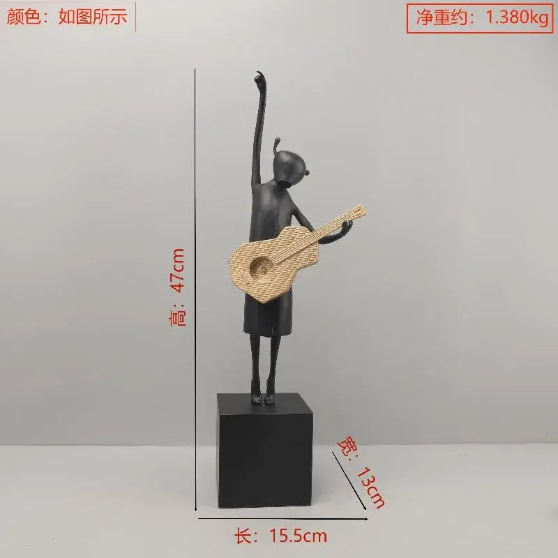 Stylized black and gold guitarist resin figure holding a woven wicker guitar on a black base for decorbites guitarist resin decorbites guitarist resin sculptures