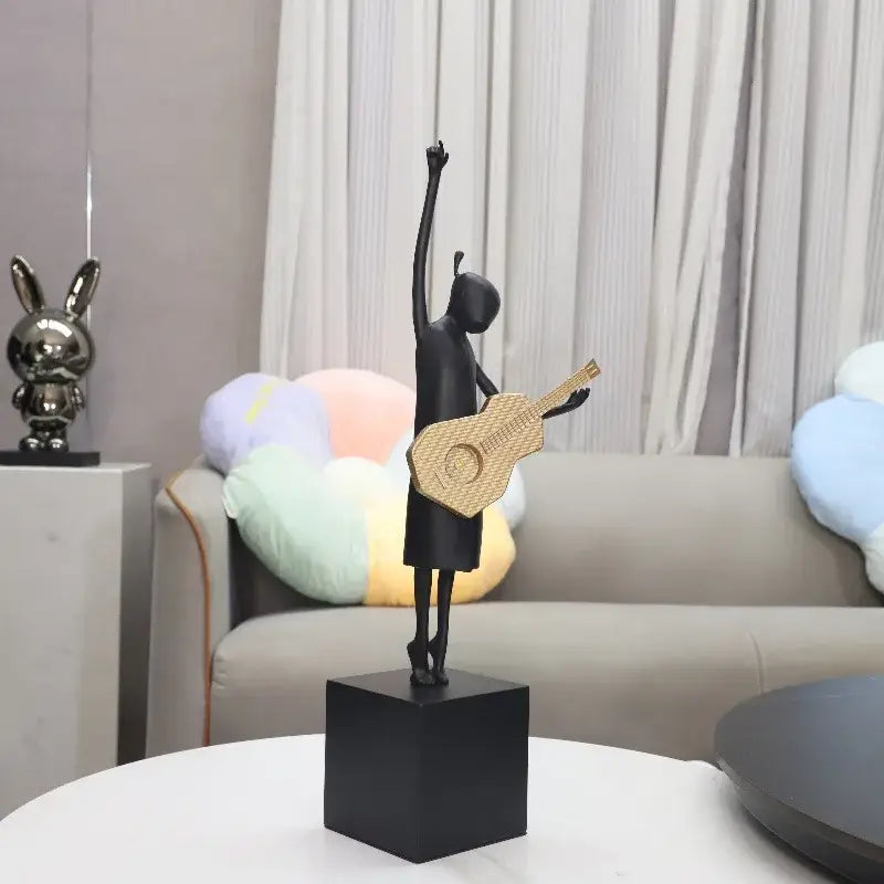 Stylized black and gold guitarist resin figure sculpture with woven guitar on black base for living room decorbites guitarist resin