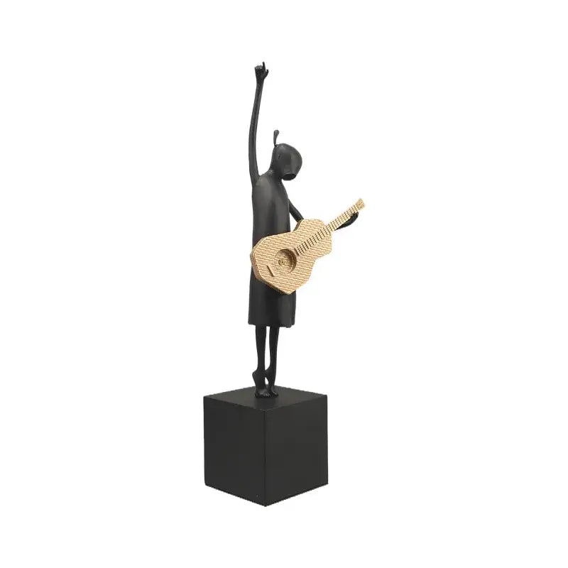 Stylized black and gold guitarist resin figure sculpture on black cube base ideal for living room decorbites guitarist resin decor