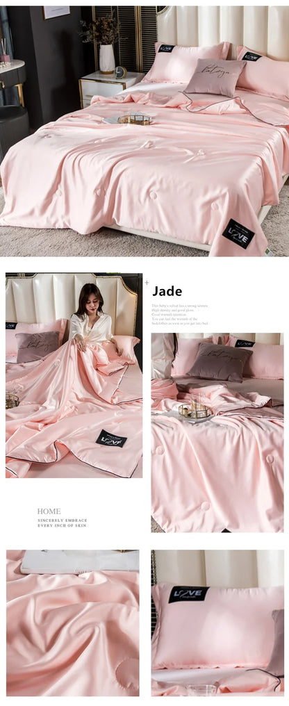 Pink satin summer mulberry silk comforter duvet insert with subtle sheen and black embroidered label pillows