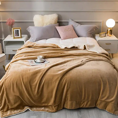 A caramel-colored plush fleece throw blanket with soft velvety texture from decorbites cozy lambswool flannel collection