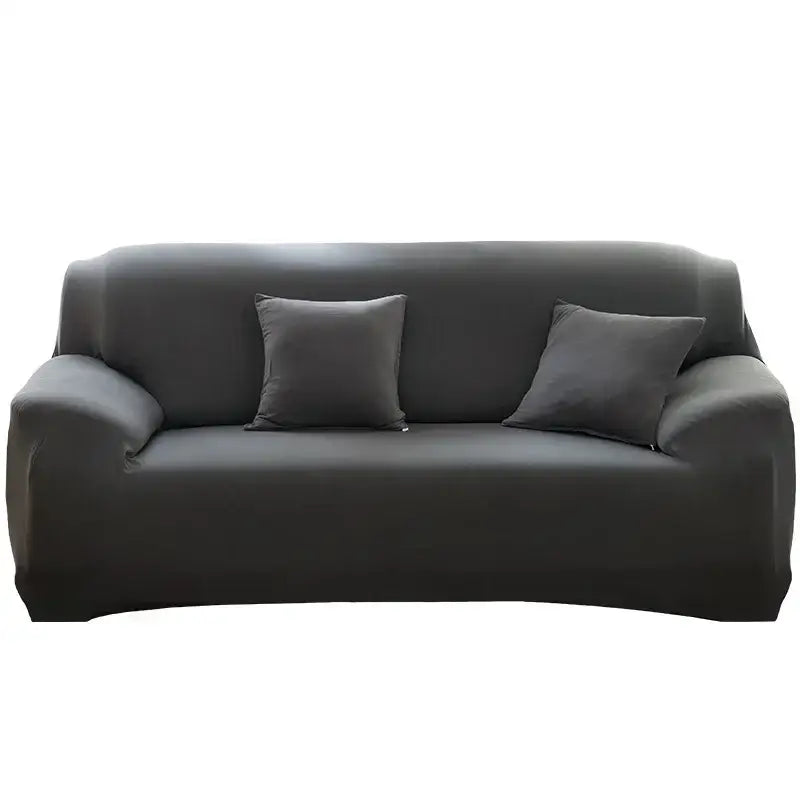 Black stretchy fabric sofa cover with two matching dark gray throw pillows for living room and accent chairs