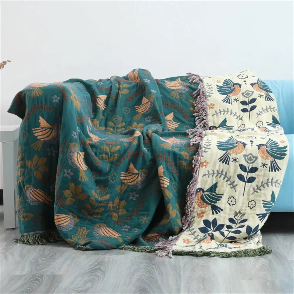 Teal and cream birds jacquard cotton sofa cover with embroidered bird and floral patterns and fringed edges for living room decor