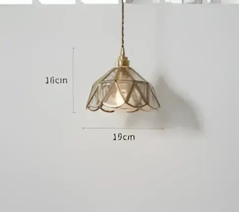 Teal blue glass pendant light with brass hardware and delicate lace-like petal shade for dining room decorbites blue glass