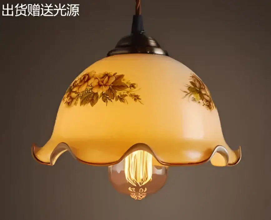 Teal blue glass pendant light with brass hardware and warm-toned floral decal bulb for dining room decorbites blue glass pendant lights