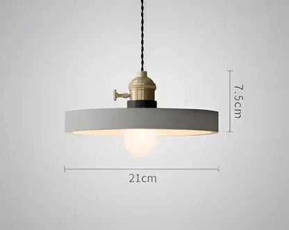 Gray minimalist pendant light with brass industrial fixture and exposed bulb complements decorbites blue glass pendant lights