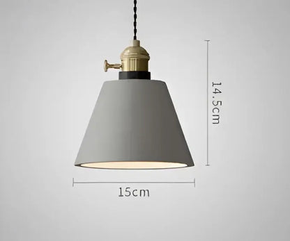 Gray conical pendant light with brass-finished industrial fixture and black cord complementing decorbites blue glass pendant lights