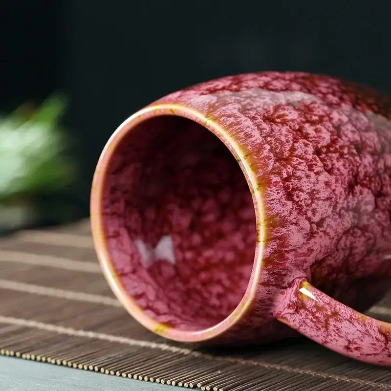 Red 480ml ceramic mug with textured glaze and golden accents along rim and handle for kitchen coffee use