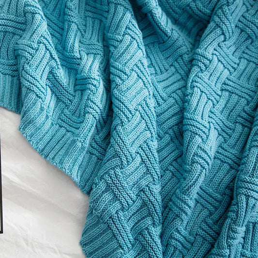 Teal cable knit cozy jacquard blanket with textured interwoven pattern perfect as a decorbites cozy living room throw