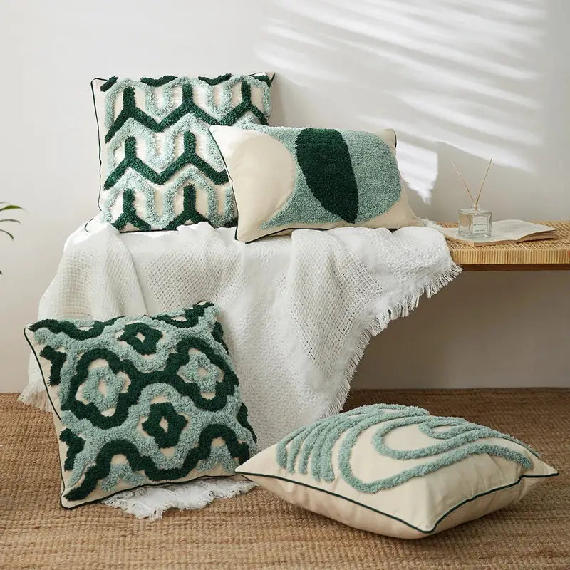 Set of four green and cream textured throw pillows with chunky geometric embroidery tassel cushion case decorbites design
