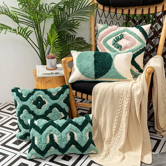 Set of three teal and dark green geometric embroidery tassel cushion cases with cream accents for living room decorbites decor