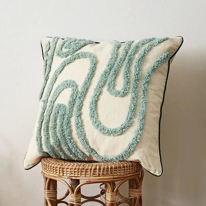 Cream-colored cushion case with light blue textured yarn swirls and black trim decorbites geometric embroidery tassel decor