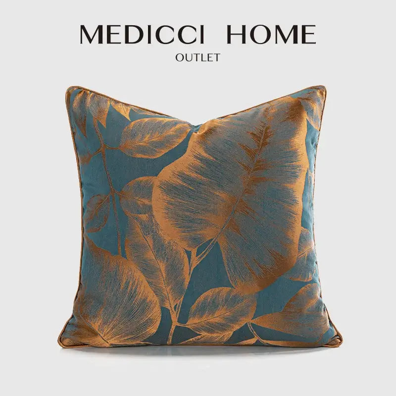 A teal and gold satin cushion cover with banana tree leaves jacquard pattern for living room decor