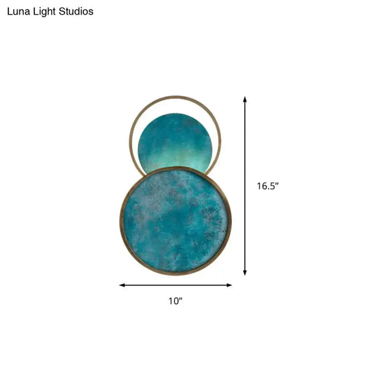 Teal and gold blue glass led sconce with distressed finish and warm white light for living room wall decor