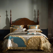 Luxurious teal and gold embroidered 200s egyptian cotton bedding set with ruffled gold satin edges and intricate embroidery