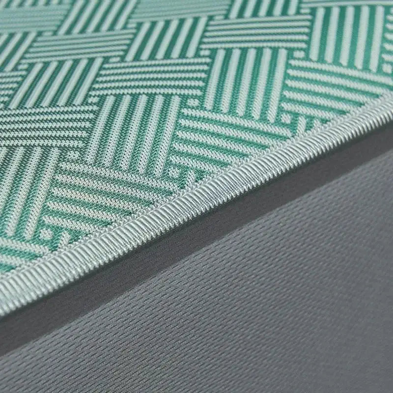 Teal herringbone silky soft fitted sheet set featuring a teal and white woven patterned mat with ribbed edge