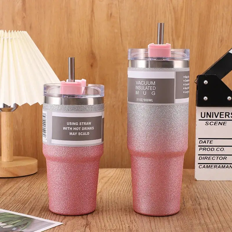 Pink glitter-finish decorbites coffee cup thermos with silver rim and pink straw lid for insulated use