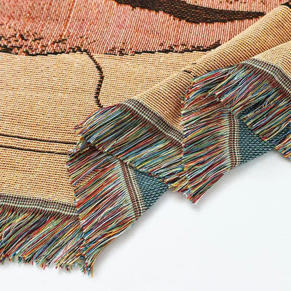 A woven tapestry knitted nordic outdoor sofa blanket with earthy tones and multicolored fringe for living room decorbites decor