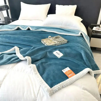 Teal cozy flannel nap blanket with white knitted border and soft plush velvety texture for bedroom use