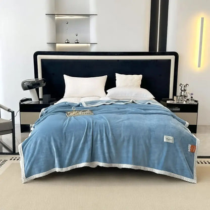 A light blue cozy flannel nap blanket with white textured border and subtle stitching perfect for bedroom use
