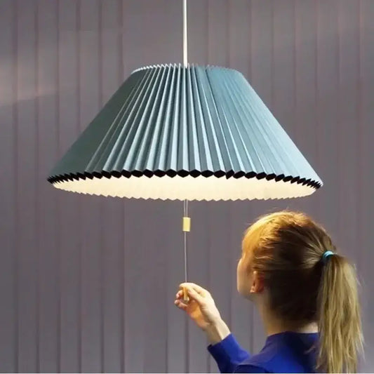 A modern teal decorbites deformed fabric umbrella pendant lamp with black scalloped edge and white inner shade for dining room