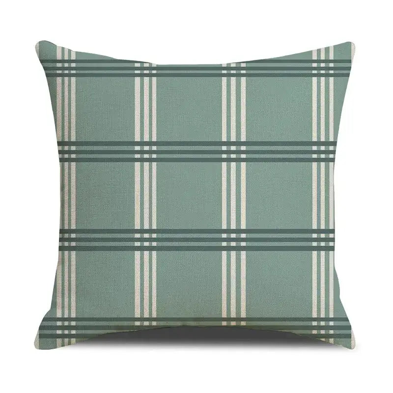 A square throw pillow with a sage green base and cream and dark teal plaid stripes in a decorbites deer grid line design