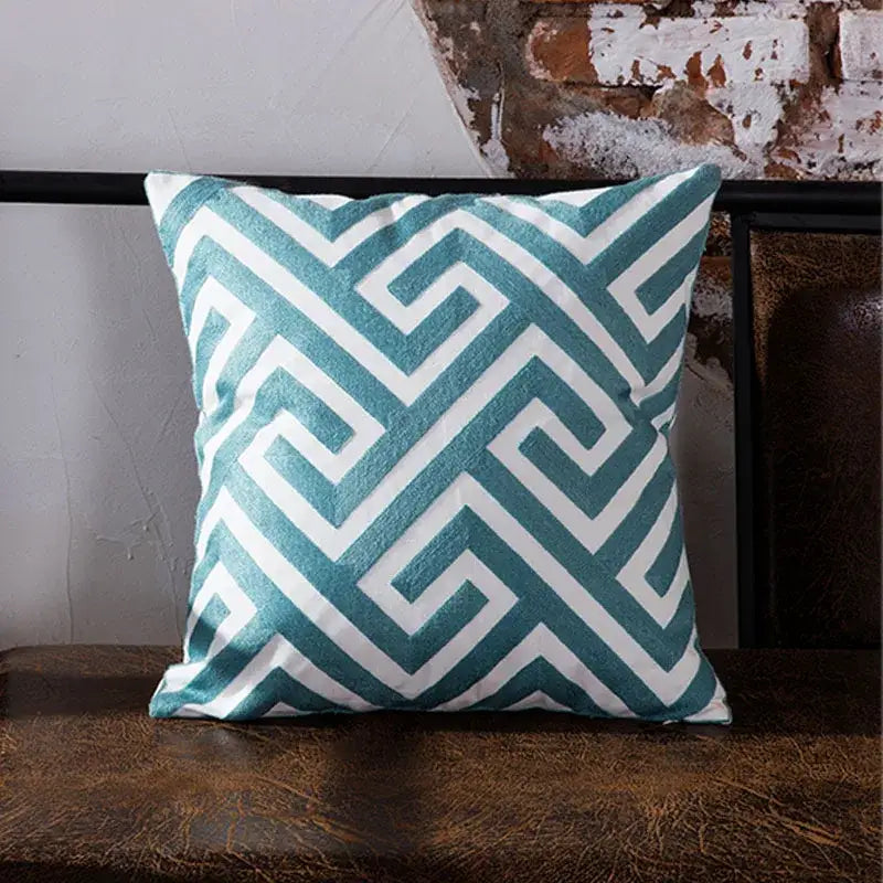 Teal and white geometric embroidered cushion cover with textured fabric finish for living room decorbites blue geometric style