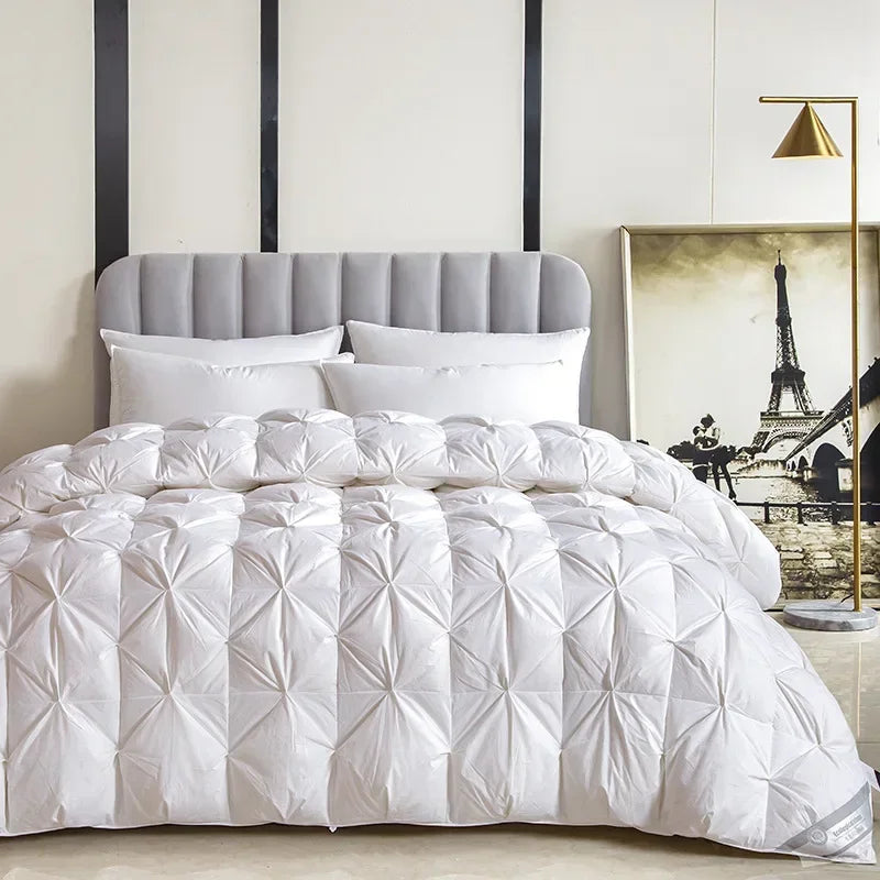 White quilted comforter with diamond-patterned design made of white goose down for warmth and comfort