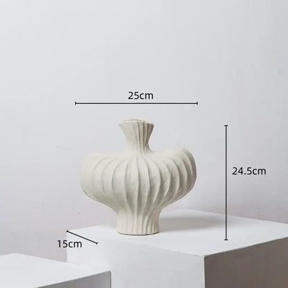 A white ceramic fringe heterophore vase with ribbed bulbous body and fluted neck for living room decorbites decor